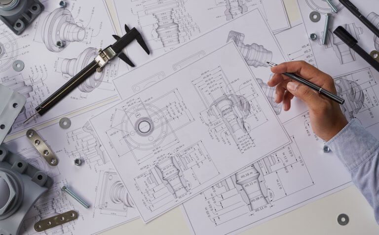 Engineer technician designing drawings mechanical